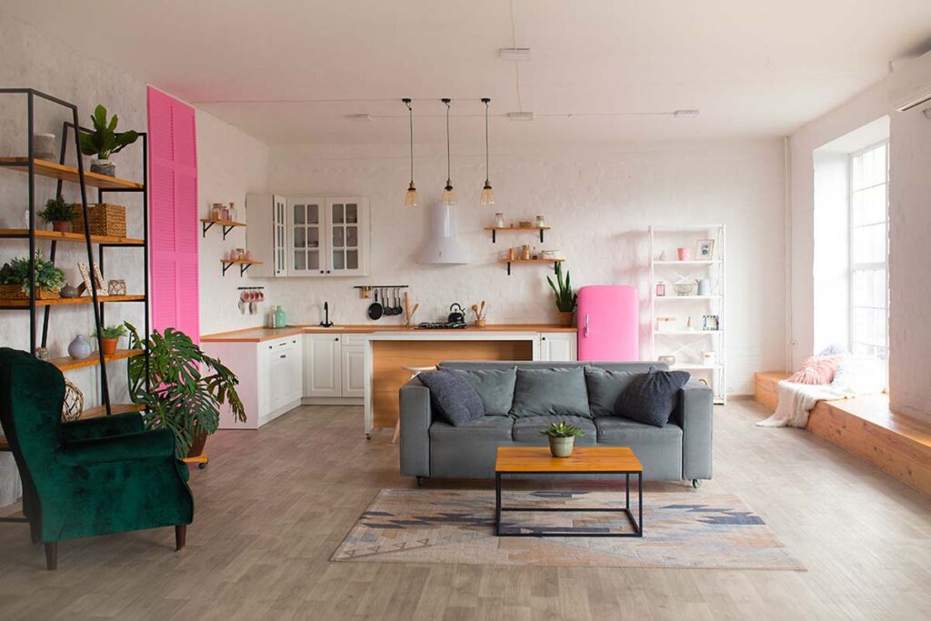 Open space coerente: Il trucco della “pavimentazione continua” per unire cucina e salotto con stile