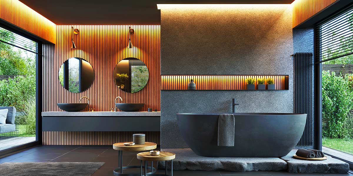 Bagno di design con vasca e lavabi nero opaco, rivestimenti in legno e luce calda, affaccio sul giardino.